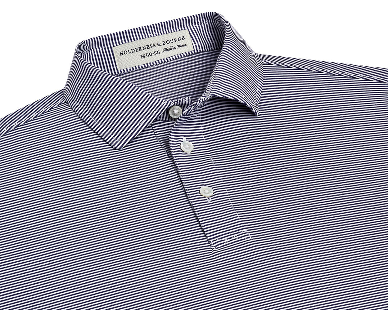 The Perkins Boys Shirt: Navy & White, features a micro-striped design, classic collar, and three-button placket, crafted from breathable DryLuxe fabric with UPF 50+ protection.