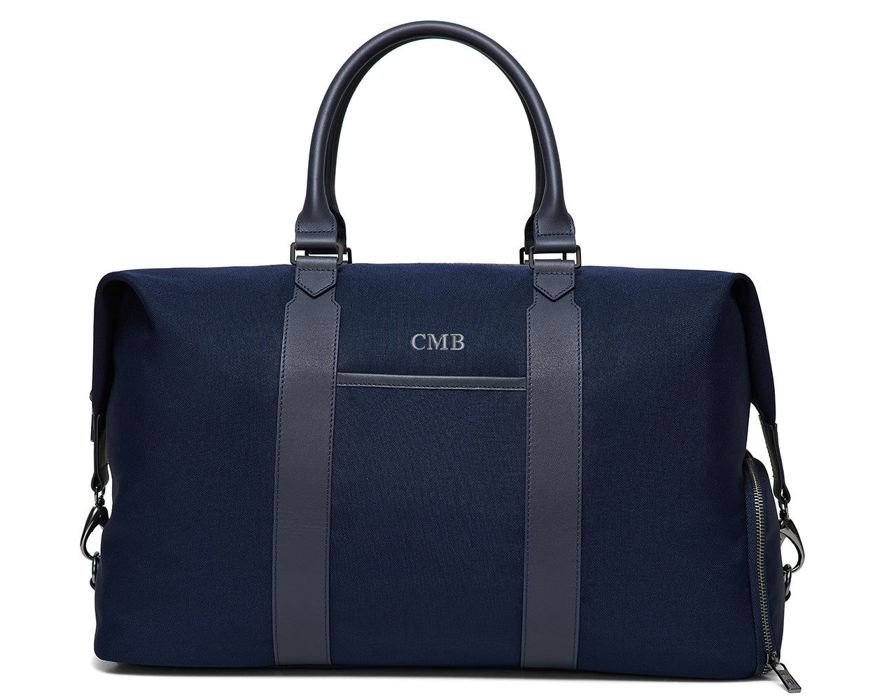 The Byers Duffel Bag: Navy Ballistic - Slate Blue Embroidery, featuring leather trim, dual handles, monogram CMB, and metal hardware for a shoulder strap.