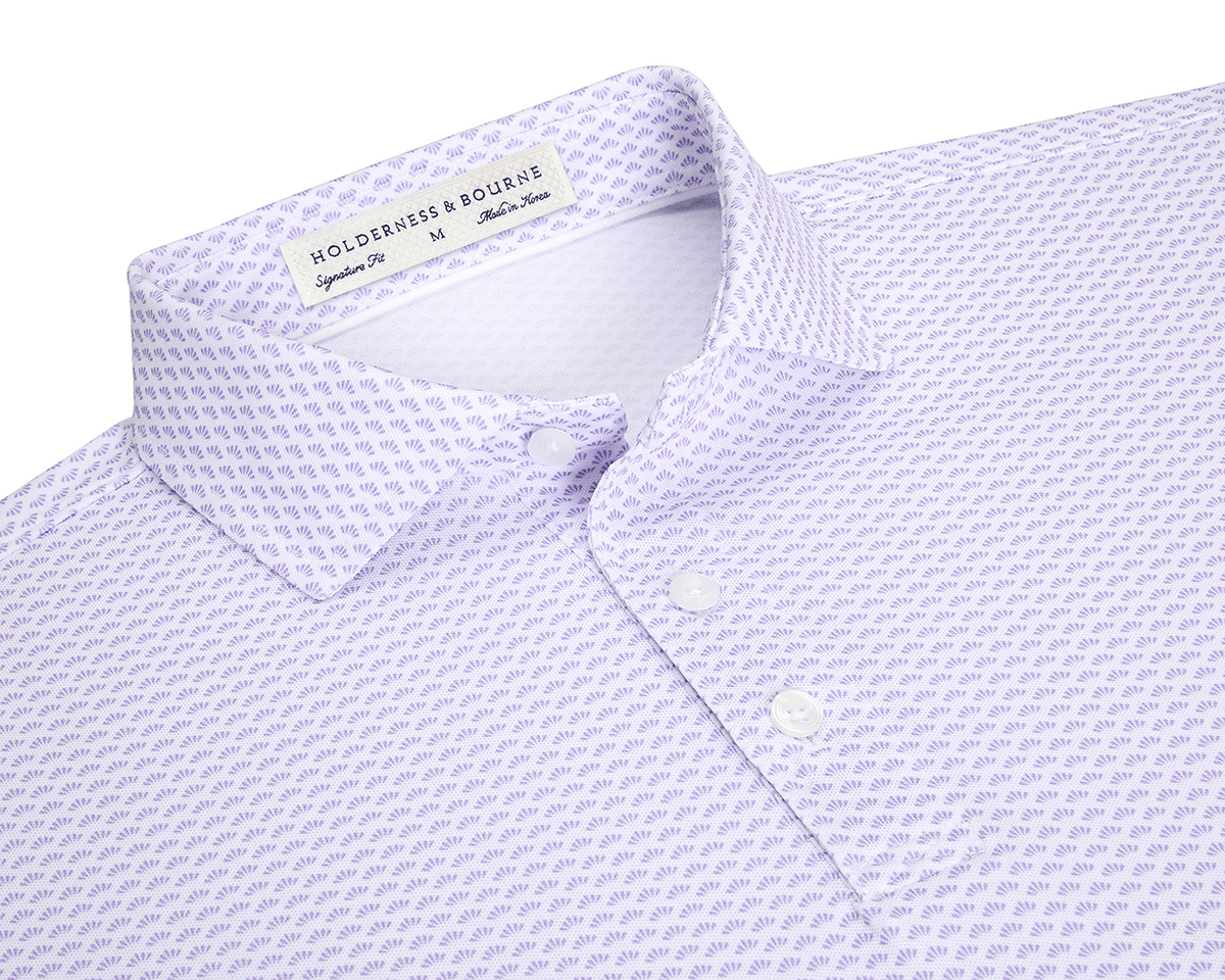The Geiger Shirt: Tudor features a lavender-purple motif on white fabric, showcasing its spread collar and three-button placket, emphasizing Holderness & Bourne's signature fit.