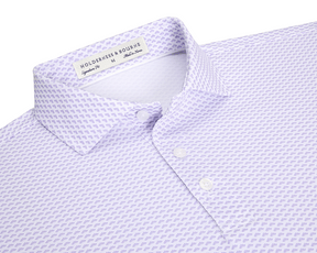 The Geiger Shirt: Tudor features a lavender-purple motif on white fabric, showcasing its spread collar and three-button placket, emphasizing Holderness & Bourne's signature fit.