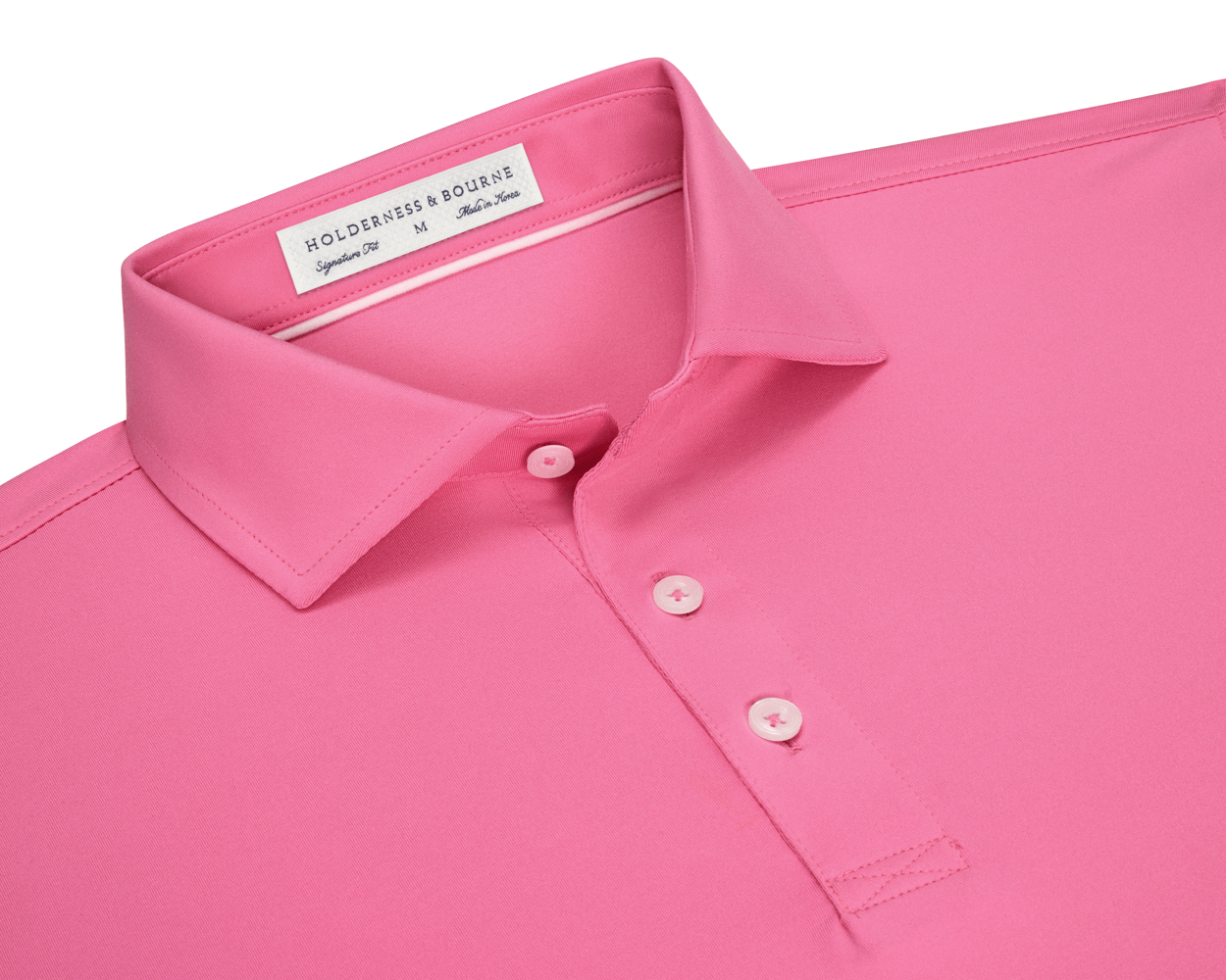 The Anderson Shirt: Belmont, a polo-style with a folded collar, three buttons, and “Holderness & Bourne” label, offers stretch and moisture-wicking performance fabric.