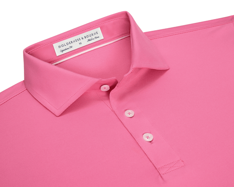 The Anderson Shirt: Belmont, a polo-style with a folded collar, three buttons, and “Holderness & Bourne” label, offers stretch and moisture-wicking performance fabric.