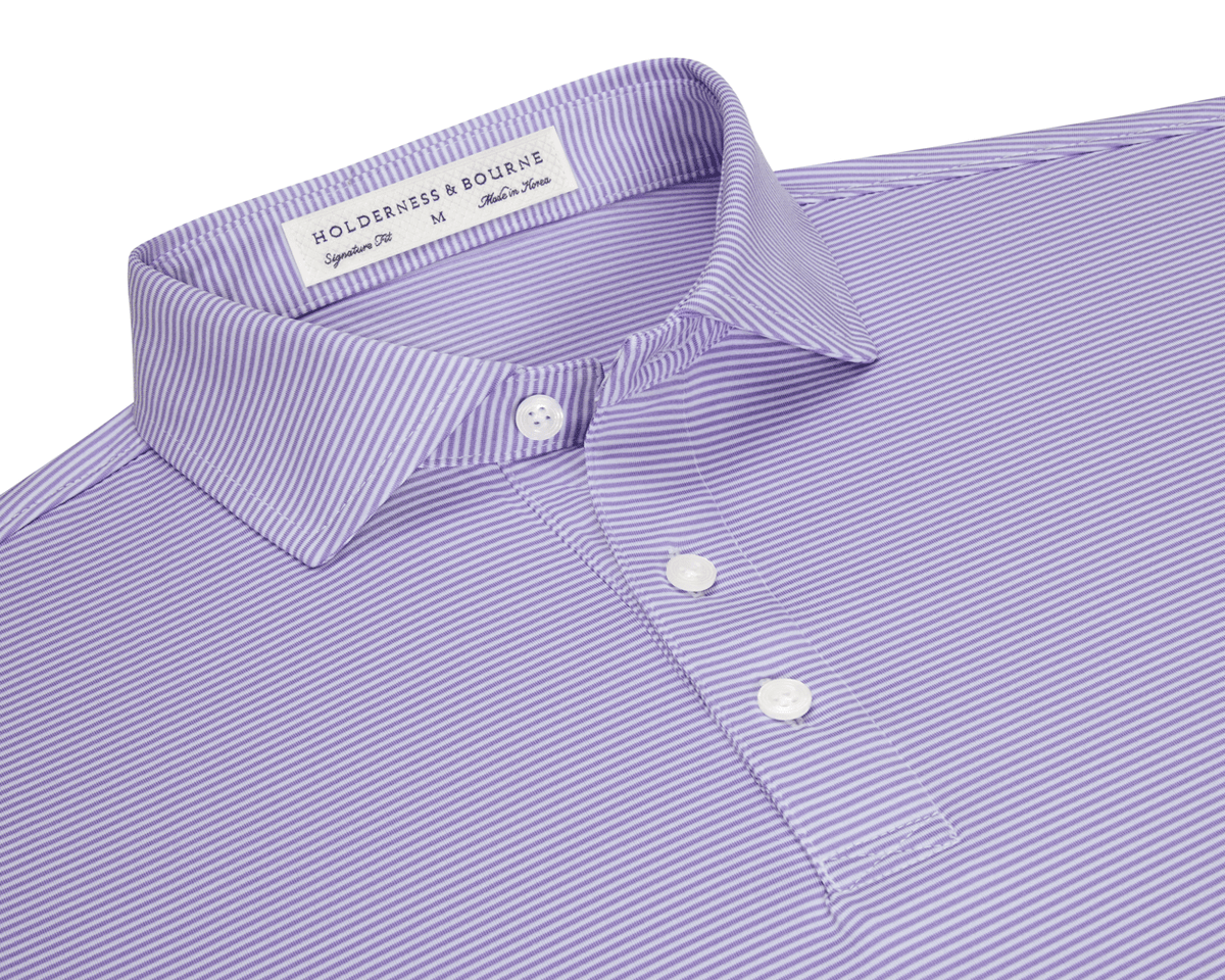 The Perkins Shirt: Tudor & White, a striped polo with a structured collar, three-button placket, and embroidered label, offers performance fabric with four-way stretch.