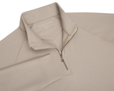 The Westland Quarter-Zip: Heathered Dune features a light tan pullover with a half-zip, soft peached fabric, and HOLDERNESS & BOURNE label visible.