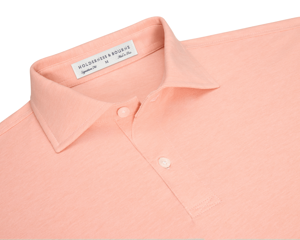 The Hatcher Shirt: Nectarine & White, showcasing a folded collar, two buttons, and Holderness & Bourne label, crafted from soft Peruvian Pima cotton for comfort and stretch.