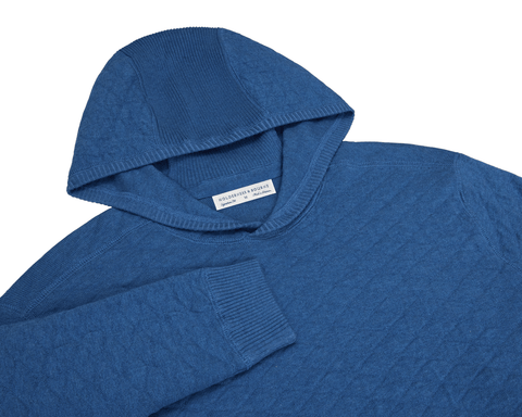 The Wallace Hoodie Sweater in heathered Maidstone blue, featuring ribbed hood lining, cuffs, and side panels, made from 100% Egyptian cotton.