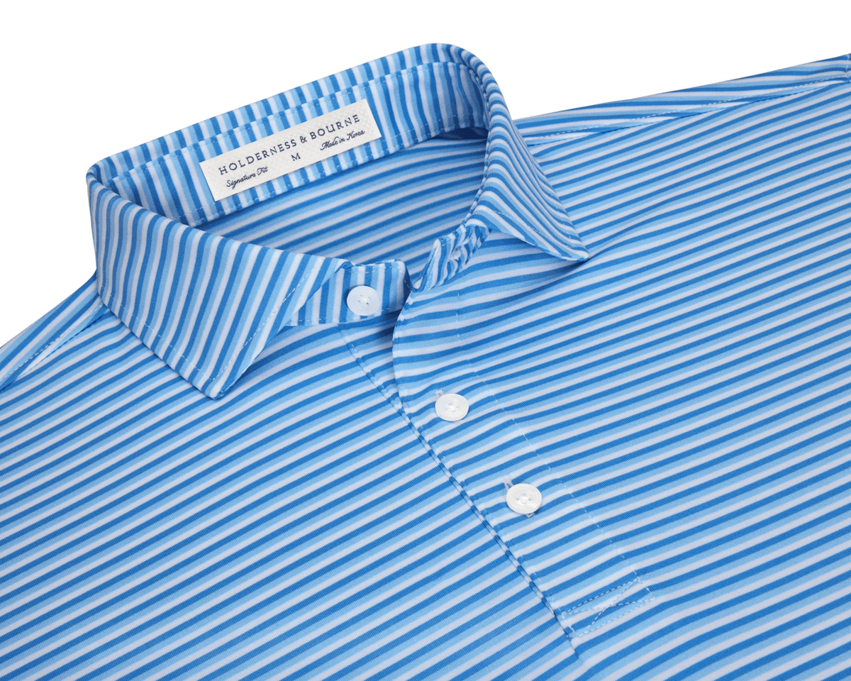 The Fleming Shirt: Horizon Blue/Vista Blue/White with light-blue and white stripes, three-button placket, and structured spread collar. Signature fit and performance jersey fabric.