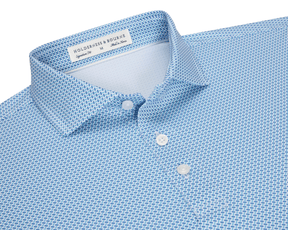 The Norman Shirt: Harbor & Maidstone Blue, a light-blue polo with subtle dark blue geometric pattern, classic collar, and three-button placket, featuring UPF 50+ protection.