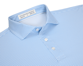 The Norman Shirt: Vista Blue & Horizon Blue, featuring a micro-textured dash pattern, spread collar, and white buttons, with performance jersey for comfort and UV protection.