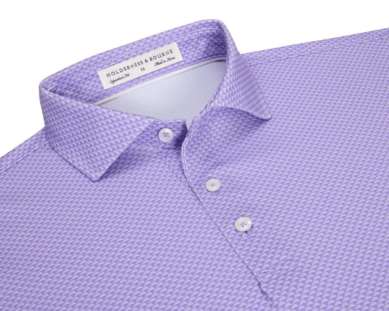The Eaton Shirt: Tudor, a lavender-purple men’s polo with geometric texture, features a spread collar, three-button placket, and is designed for warm-weather performance.
