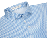 The Justice Shirt: Harbor & Maidstone Blue, featuring a light-blue polo with a navy eagle pattern, structured collar, and three white buttons.