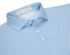 The Justice Shirt: Harbor & Maidstone Blue, featuring a light-blue polo with a navy eagle pattern, structured collar, and three white buttons.