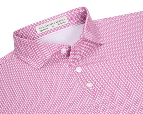 The Hanover Shirt: Cabernet, showing a close-up of the collar and placket with mother-of-pearl buttons, features a pink geometric jet pattern and label details.