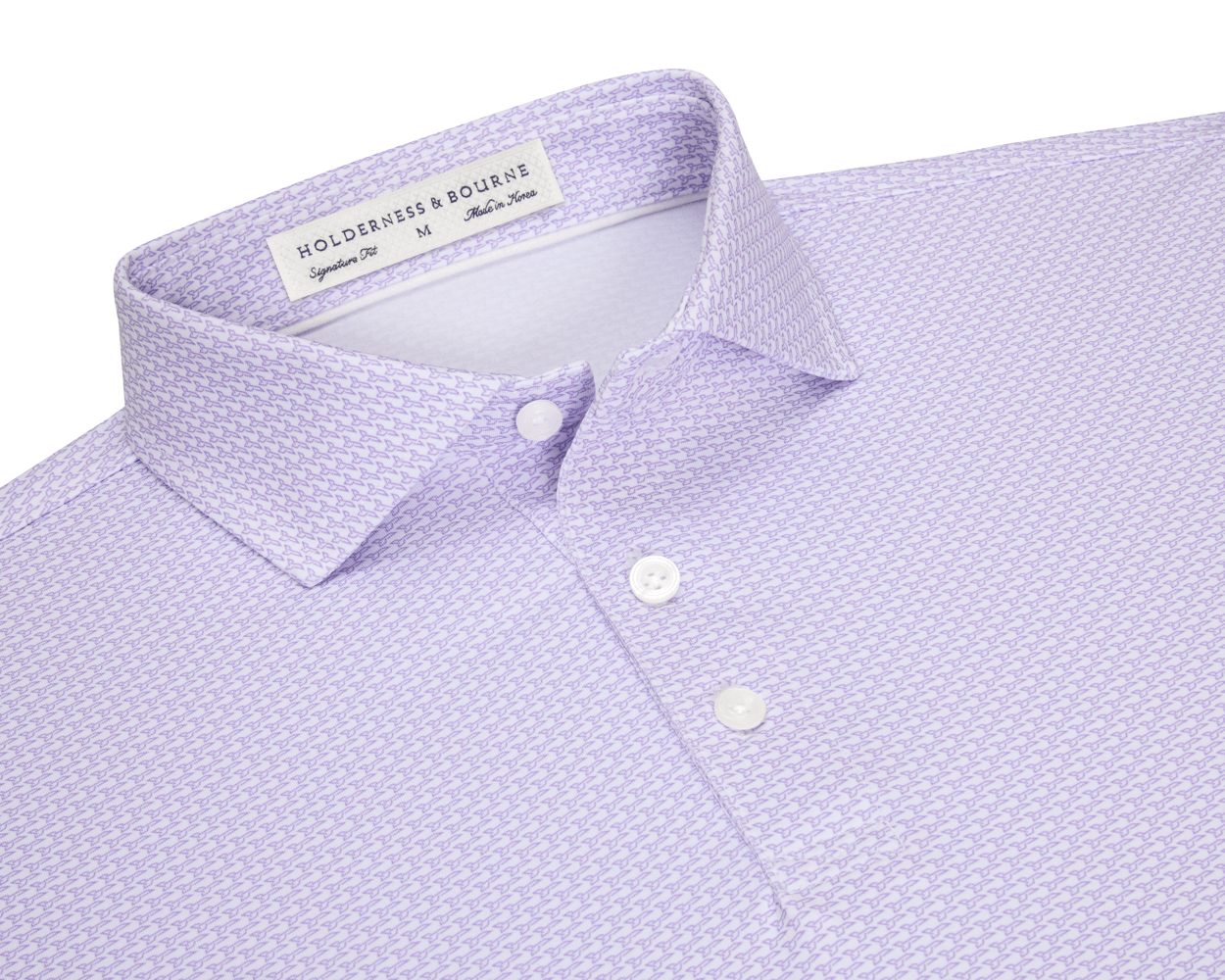 The Hanover Shirt: Tudor, a light lavender polo with a micro-pattern, features a soft spread collar, three white buttons, and a woven label.