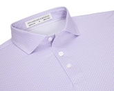 The Hanover Shirt: Tudor, a light lavender polo with a micro-pattern, features a soft spread collar, three white buttons, and a woven label.