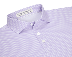 The Hanover Shirt: Tudor, a light lavender polo with a micro-pattern, features a soft spread collar, three white buttons, and a woven label.