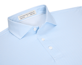 The Hanover Shirt: Vista Blue, a light-blue short-sleeve polo with a micro-pattern, features a structured collar, three-button placket, and signature fit.