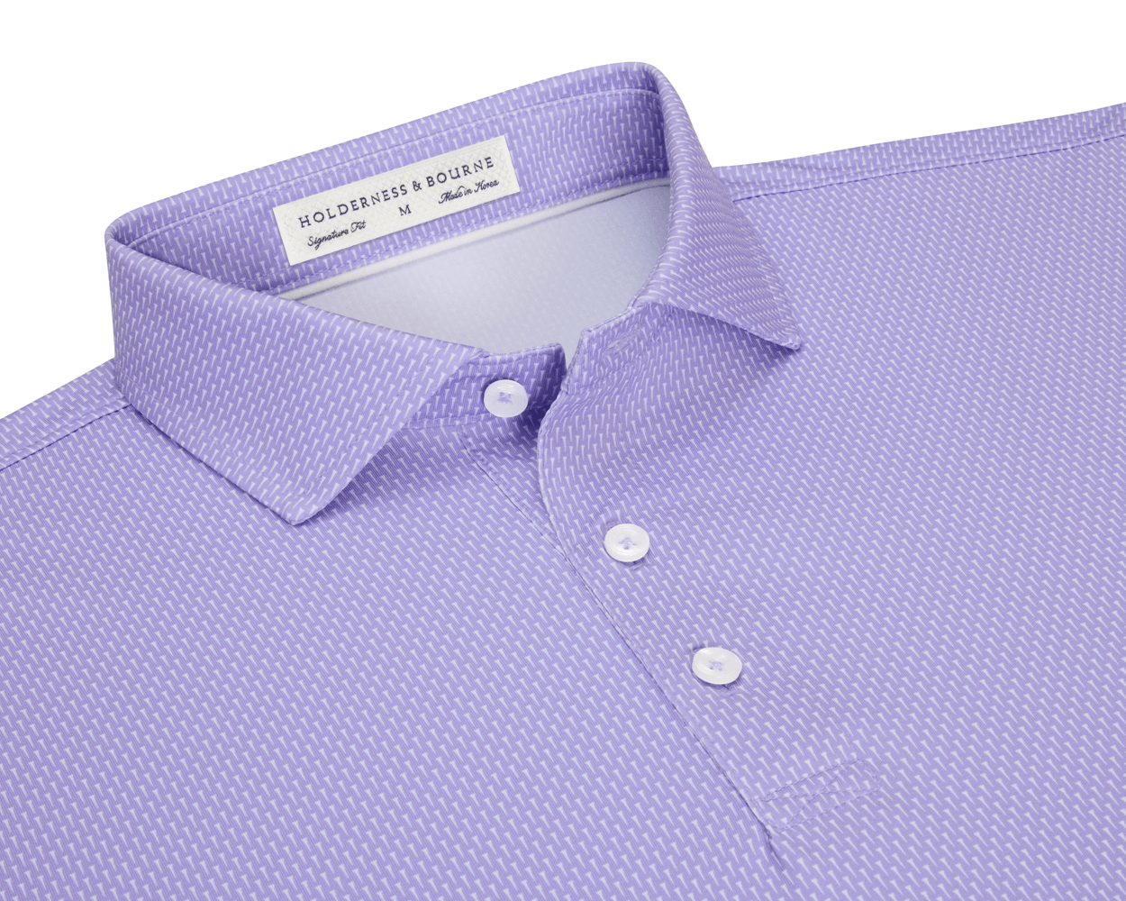 The Hicks Shirt: Tudor features a folded polo with a dash pattern, classic collar, three-button placket, and is crafted from breathable, moisture-wicking performance jersey.