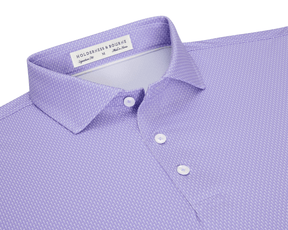 The Hicks Shirt: Tudor features a folded polo with a dash pattern, classic collar, three-button placket, and is crafted from breathable, moisture-wicking performance jersey.
