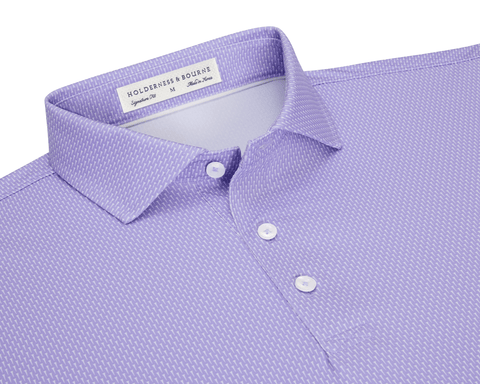 The Hicks Shirt: Tudor features a folded polo with a dash pattern, classic collar, three-button placket, and is crafted from breathable, moisture-wicking performance jersey.