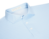 The Cromwell Shirt: Vista Blue & Horizon Blue, features a geometric print, white buttons, and a structured collar, made from AIRATION® fabric for breathability and comfort.