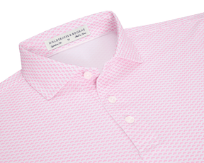 The Geiger Shirt: Belmont features a fan-patterned light-pink polo, three white buttons, and a structured collar, offering breathable, moisture-wicking comfort and UPF 30+ protection.