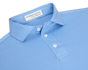 The Perkins Boys Shirt: Horizon Blue & White features a pinstripe design, spread collar, and three-button placket, crafted from breathable, moisture-wicking DryLuxe fabric with UPF 50+ protection.