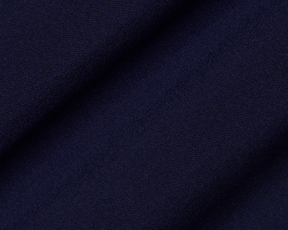 Close-up of The Anson Chino Pant: Navy, showcasing its fine woven texture and draping, highlighting the eco-friendly, wrinkle-resistant, and water-repellent fabric with four-way stretch.