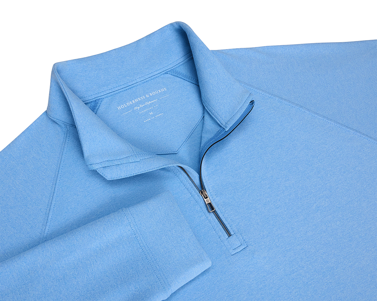 The Westland Quarter-Zip: Heathered Vista Blue features a light-blue, long-sleeve design with a stand-up collar, showcasing a sleek gunmetal chrome trim.