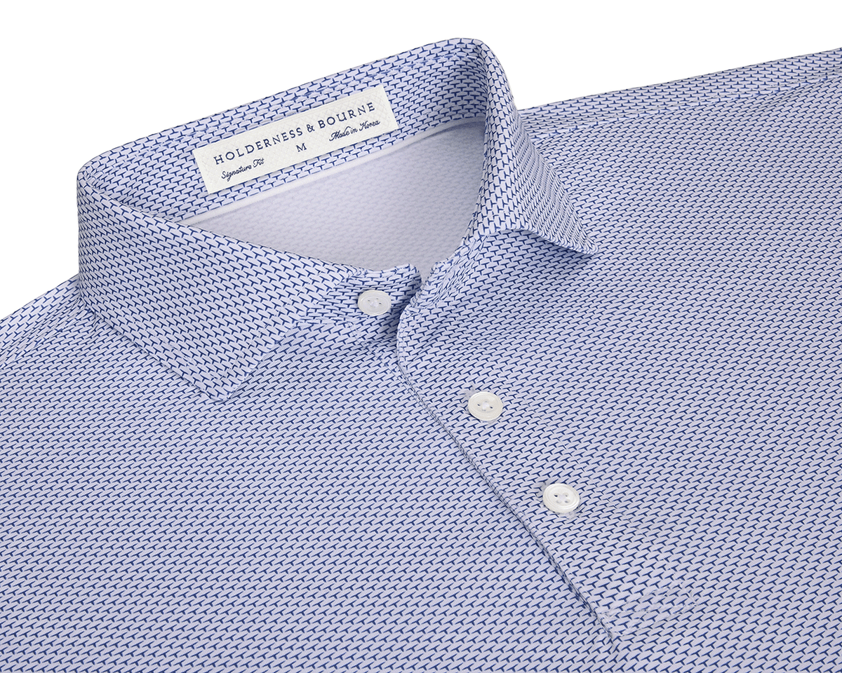 The Armfield Shirt: Andover, a men’s polo with a spread collar, three-button placket, and a subtle geometric pattern, labeled “HOLDERNESS & BOURNE.”