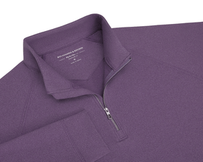 The Westland Quarter-Zip: Heathered Amherst features a stand-up collar, metal zipper, and soft, moisture-wicking fabric, perfect for versatile wear.