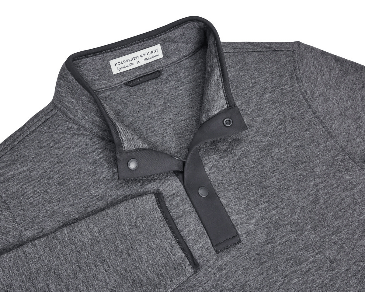 The Sullivan Quarter-Snap: Heathered Charcoal pullover with a stand-up collar, partial snap-button placket, buttery fabric, and diamond-quilted insulation for warmth.