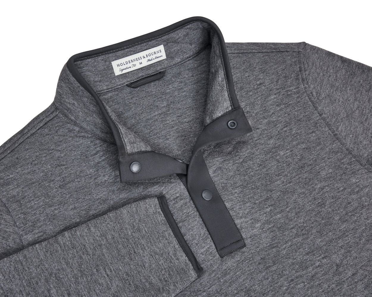 The Sullivan Quarter-Snap: Heathered Charcoal pullover with a stand-up collar, partial snap-button placket, buttery fabric, and diamond-quilted insulation for warmth.