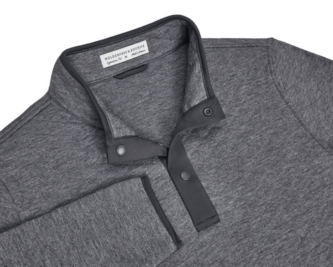 The Sullivan Quarter-Snap: Heathered Charcoal pullover with a stand-up collar, partial snap-button placket, buttery fabric, and diamond-quilted insulation for warmth.