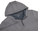The Tilley Quarter-Zip Hoodie: Heathered Charcoal, features a sleek silhouette with a hood and partial front zipper, showcasing Holderness & Bourne's label. Ideal for versatile wear.