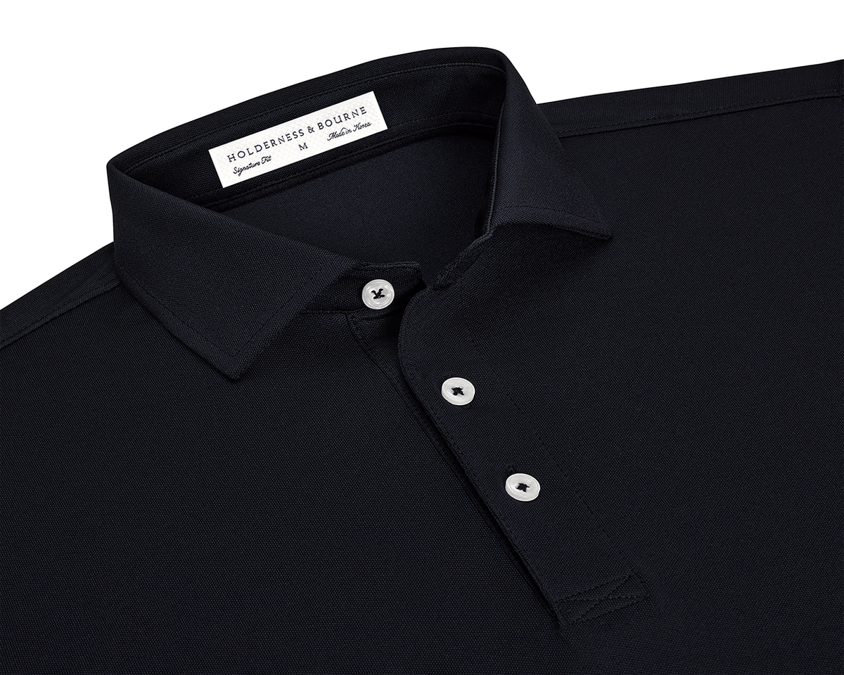 The Macdonald Shirt: Black, featuring a three-button placket, spread collar, and contrast piping, offers breathable comfort with its lightweight synthetic and stretch fibers.
