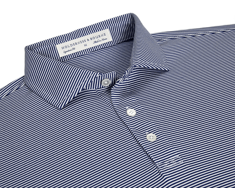 The Perkins Shirt: Navy & White features a micro-stripe knit with a point collar, three-button placket, and moisture-wicking performance fabric for versatile wear.