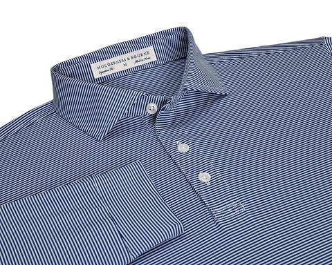 The Burke Shirt: Navy & White, folded long-sleeve polo with fine stripes, features a button-down placket, structured collar, and Holderness & Bourne tag.