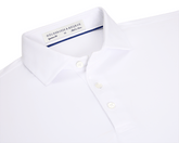 The Anderson Shirt: White, short-sleeved polo with structured spread collar, three-button placket, and performance fabric for stretch and moisture wicking. Size M, made in Korea.
