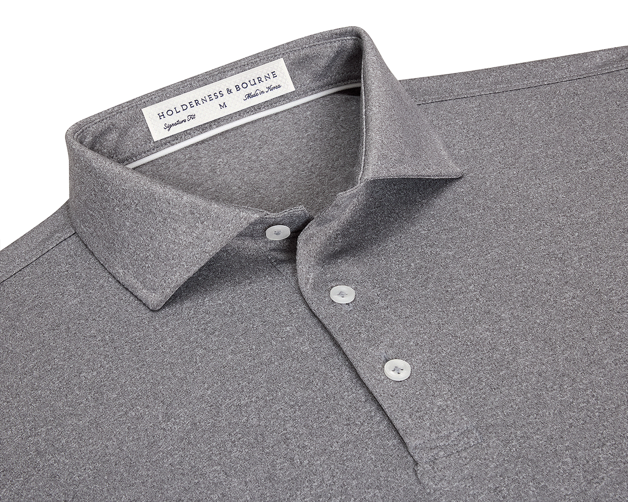 The Anderson Shirt: Heathered Gray features a classic collar, three-button placket, and jersey knit fabric for stretch and moisture-wicking comfort.