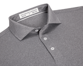 The Anderson Shirt: Heathered Gray features a classic collar, three-button placket, and jersey knit fabric for stretch and moisture-wicking comfort.