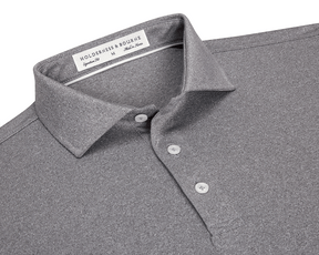 The Anderson Shirt: Heathered Gray features a classic collar, three-button placket, and jersey knit fabric for stretch and moisture-wicking comfort.
