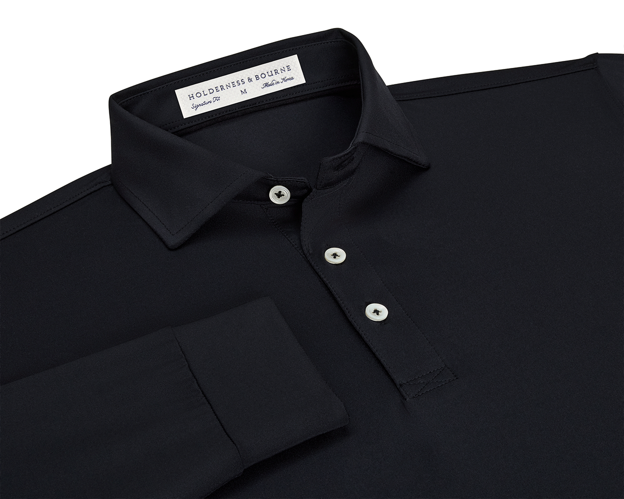 The Farrell Shirt: Black, features a long-sleeve polo design with light buttons, a spread collar, and Holderness & Bourne label, offering comfort and moisture wicking.