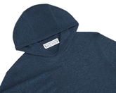 The Logan Hoodie Sweater: Heathered Andover, showcasing a blue knitted Merino wool/cashmere blend, features a hood, ribbed cuffs, and smooth stockinette body.