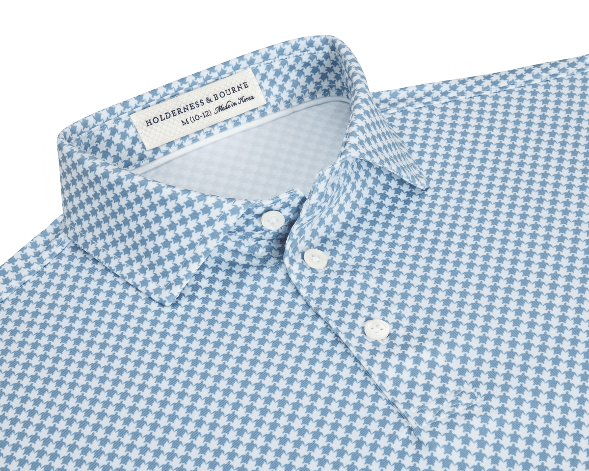 The Kitts Boys Shirt: Bedford features a light-blue-and-white houndstooth pattern with a structured collar, white buttons, and a turtle print for added playfulness.