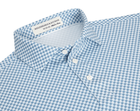 The Kitts Boys Shirt: Bedford features a light-blue-and-white houndstooth pattern with a structured collar, white buttons, and a turtle print for added playfulness.