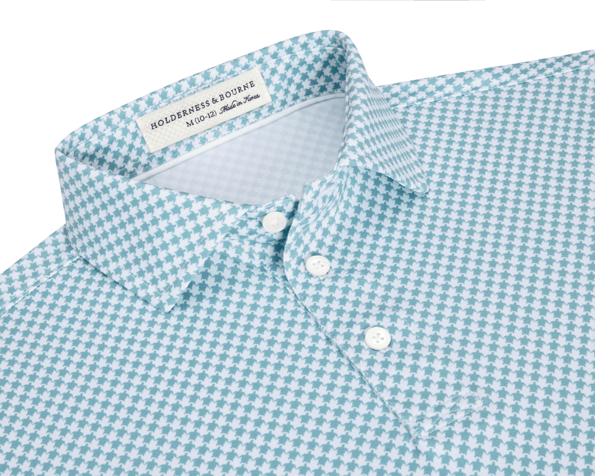 The Kitts Boys Shirt: Harbor, featuring a blue-green and white houndstooth pattern, point collar, three-button placket, and Holderness & Bourne label.