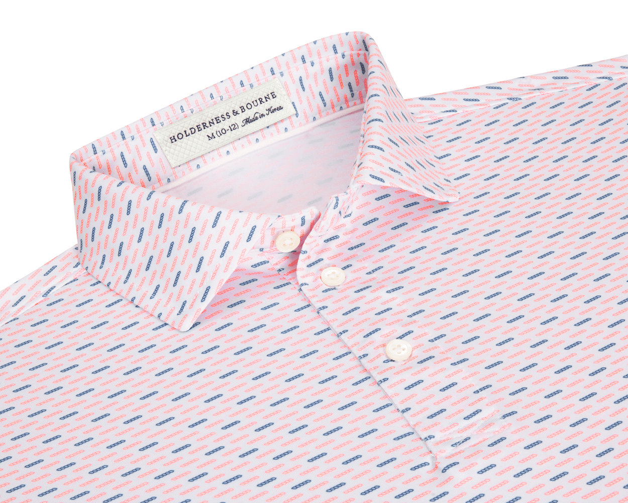 The James Boys Shirt: Cape & Andover features a light polo with coral and navy dash pattern, structured collar, and three white buttons.