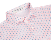 The James Boys Shirt: Cape & Andover features a light polo with coral and navy dash pattern, structured collar, and three white buttons.