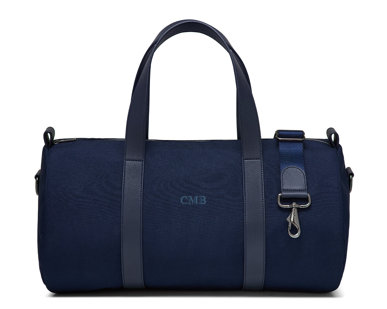 The Marston Banker Bag: Navy Ballistic - Navy Embroidery, features a cylindrical design, two handles, adjustable strap, and CMB monogram, ideal for gym or club outings.